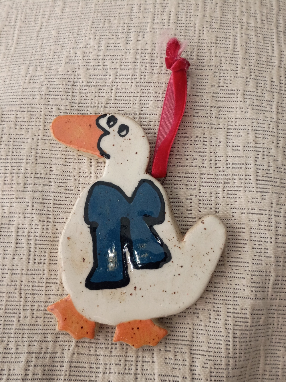 Handcrafted White Ceramic Duck Ornament with Blue Bow